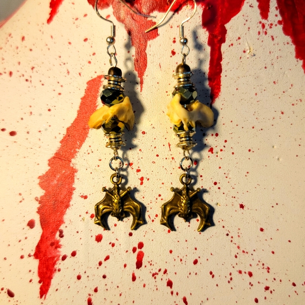 Bat earings with bone.